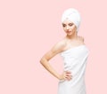 Young, beautiful and natural woman wrapped in towel isolated on Royalty Free Stock Photo