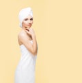Young, beautiful and natural woman wrapped in towel isolated on Royalty Free Stock Photo