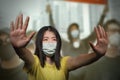 Young beautiful pacifist Asian woman angry protesting on street demonstration standing for freedom and human rights showing clean