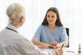 A young and beautiful patient talking to a doctor for history taking for a cure Royalty Free Stock Photo