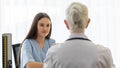 A young and beautiful patient talking to a doctor for history taking for a cure Royalty Free Stock Photo