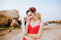 Young beautiful pin up girl in red swimsuit posing Royalty Free Stock Photo