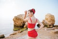 Young beautiful pin up girl in red swimsuit posing Royalty Free Stock Photo