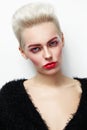 Young beautiful platinum blond glamorous woman with red mascara