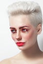 Young beautiful platinum blond glamorous woman with red mascara