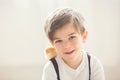 Young beautiful prechool boy, playing with little newborn chick