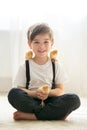 Young beautiful prechool boy, playing with little newborn chick