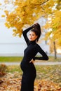 Young beautiful pregnant woman with dark hair in a black tight dress Royalty Free Stock Photo