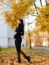 Young beautiful pregnant woman with dark hair in a black tight dress Royalty Free Stock Photo