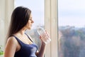 Young beautiful pregnant woman drinking water from bottle Royalty Free Stock Photo