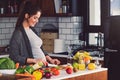 Young beautiful pregnant woman preparing healthy meal with fruites and vegetables Royalty Free Stock Photo