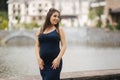 Young beautiful pregnant woman standing near the lake Royalty Free Stock Photo