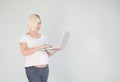 Young beautiful pregnant woman working on laptop. Pregnant business woman searching information and online shopping on Royalty Free Stock Photo