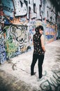 Young beautiful punk emo Coat with Hood background graffiti Royalty Free Stock Photo