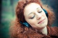 Young beautiful red curly hair woman