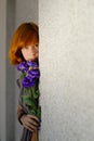 Young beautiful red hair woman holding purple chinese rose copy Royalty Free Stock Photo