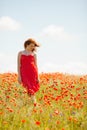 Young girl in poppy field