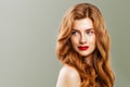 Young beautiful red haired woman. Redhead girl with ginger curly hairstyle on green background Royalty Free Stock Photo