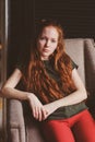 Young beautiful redhead hipster woman with no make up relaxing at home Royalty Free Stock Photo