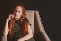 Young beautiful redhead hipster woman with no make up relaxing at home Royalty Free Stock Photo