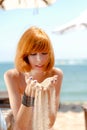 Young beautiful redhead woman in bikini on sea Royalty Free Stock Photo