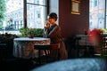 Young beautiful retro lady in cafe Royalty Free Stock Photo