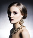 Young, beautiful and rich woman in jewels Royalty Free Stock Photo