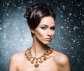 Young, beautiful and rich woman in jewels Royalty Free Stock Photo