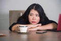 Asian Korean businesswoman working in stress at office computer desk feeling overwhelmed and frustrated suffering depression think Royalty Free Stock Photo