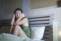 Young beautiful scared and stressed Asian Chinese woman having insomnia sitting awake in bed sleepless suffering nightmare in fear Royalty Free Stock Photo