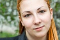 Young beautiful serene woman with african braids