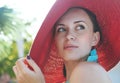 Young beautiful brunette woman wearing red straw hat Royalty Free Stock Photo