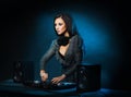 Young, beautiful and dj girl playing music on a disco party in a night club Royalty Free Stock Photo