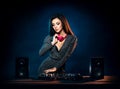 Young, beautiful and dj girl playing music on a disco party in a night club Royalty Free Stock Photo