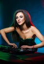 Young, beautiful and dj girl playing music on a disco party in a night club Royalty Free Stock Photo