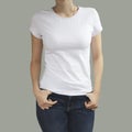 Young beautiful female with blank white shirt, front. Ready Royalty Free Stock Photo