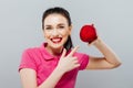 Young beautiful girl with dark hair, holding big red apple to enjoy the taste and are dieting, healthy eating and