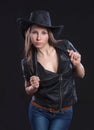 Young beautiful girl in fur waistcoat and cowboy hat Royalty Free Stock Photo