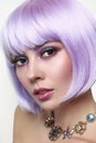 Beautiful girl with violet hair and fancy make-up Royalty Free Stock Photo