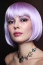 Beautiful girl with violet hair and fancy make-up Royalty Free Stock Photo