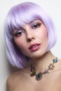 Beautiful girl with violet hair and fancy make-up Royalty Free Stock Photo