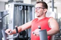 Beautiful woman man couple are doing a workout in the fitnes gym - chest press, bench Royalty Free Stock Photo