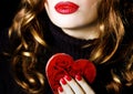 Young beautiful pretty woman holding a red heart makeup valentine love romance Royalty Free Stock Photo