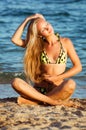 Young beautiful tanned blond woman in bikini Royalty Free Stock Photo