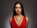 Young beautiful woman.Beauty brunette girl with make-up.red dress Royalty Free Stock Photo