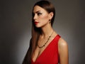 Young beautiful woman.Beauty girl wearing jewelry.elegant lady in red dress Royalty Free Stock Photo