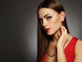 Young beautiful woman.Beauty girl wearing jewelry.elegant lady in red dress Royalty Free Stock Photo