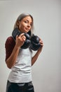 Young beautiful sexy woman boxer posing with black boxing gloves in her hands on a gray background. Copy space, gray Royalty Free Stock Photo