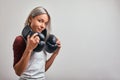 Young beautiful sexy woman boxer posing with black boxing gloves in her hands on a gray background. Copy space, gray Royalty Free Stock Photo