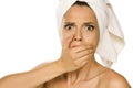 Young beautiful shocked woman with towel on her head Royalty Free Stock Photo